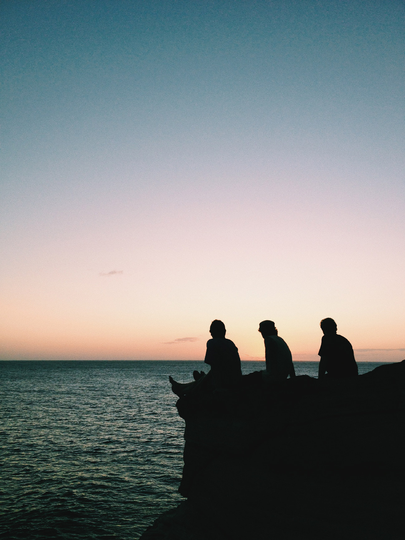 Zachy, Zach, and Matt on a cliff in Hawaii
