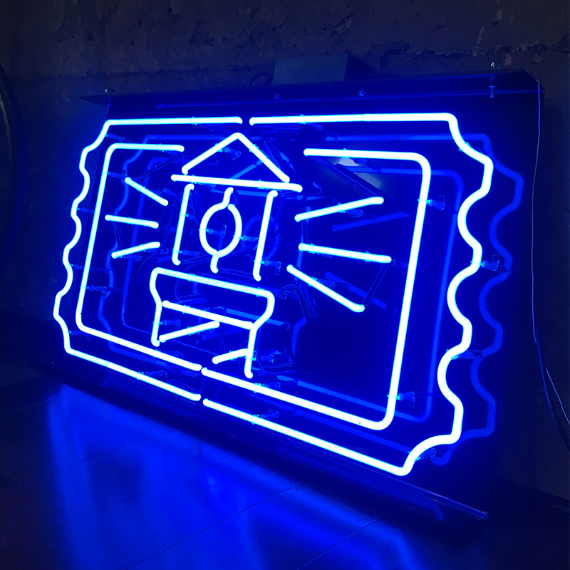A neon sign in the shape of the FareHarbor logo