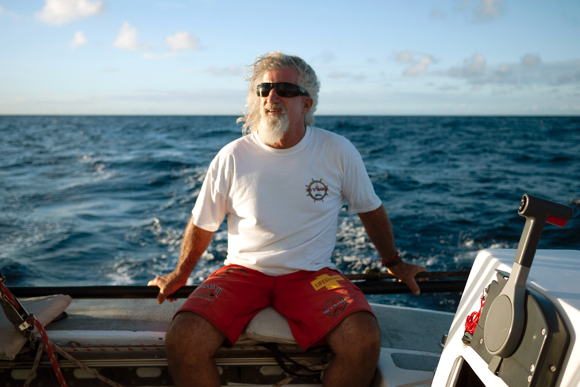 Captian Don sitting on the side of the boat