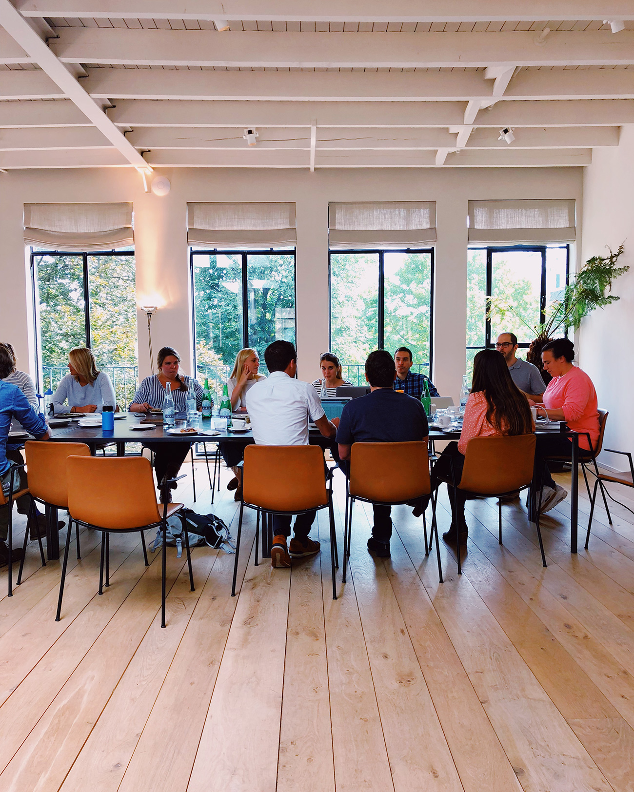 Friends around a meeting room table